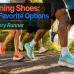 Different styles of running shoes arranged on a wooden background.